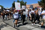 Approximately 500 persons demonstrated peacefully Saturday in Hanford at the city's Civic Park and Auditorium. 